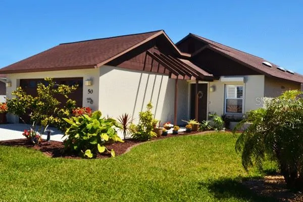 Front of the house before roof replacement and the garden grew