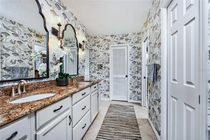 PRIMARY BATH WITH LOTS OF CABINETS. TWO NICE CLOSETS AS WELL!