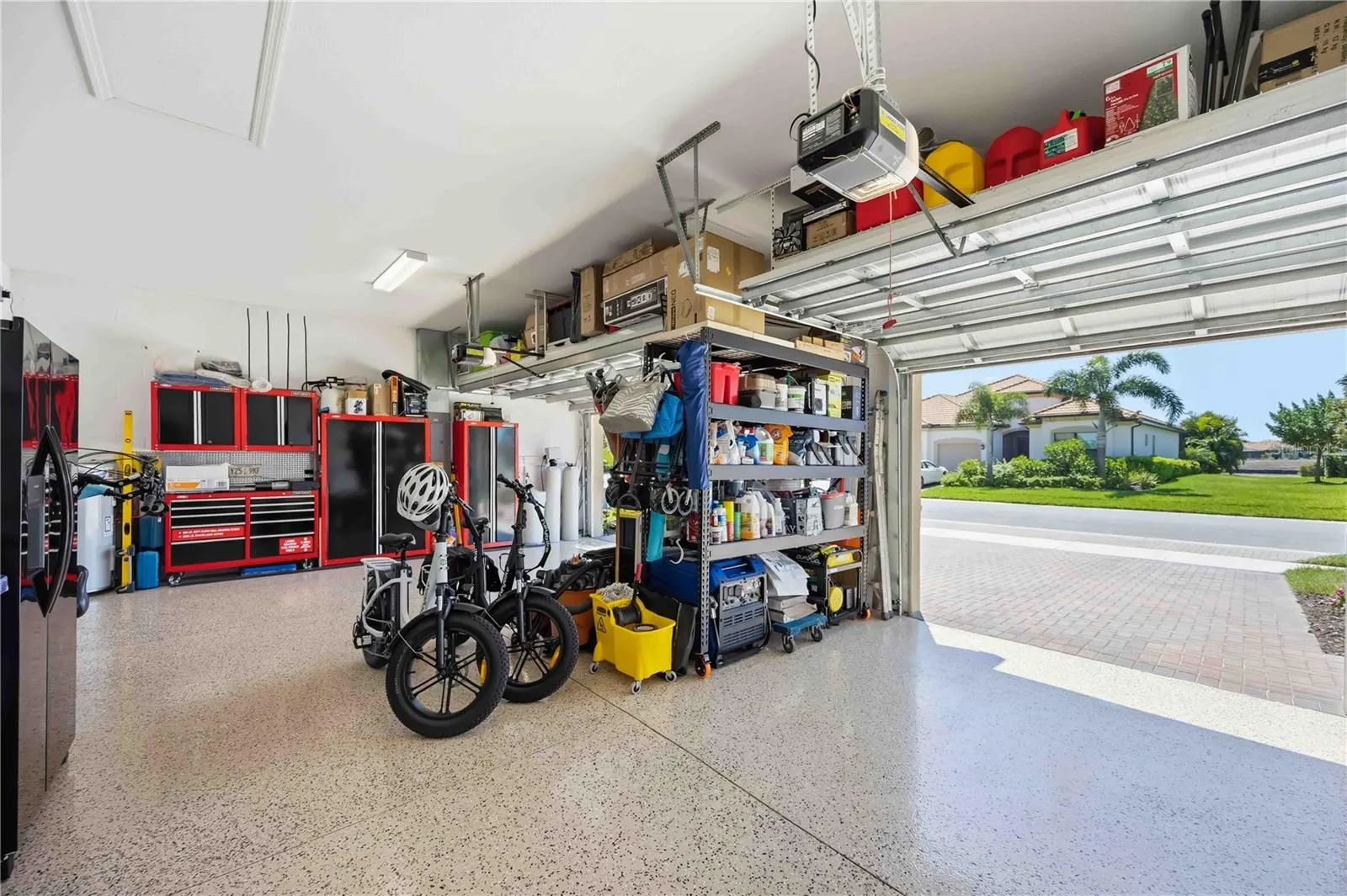 There is a 3-car garage with epoxy coating,
