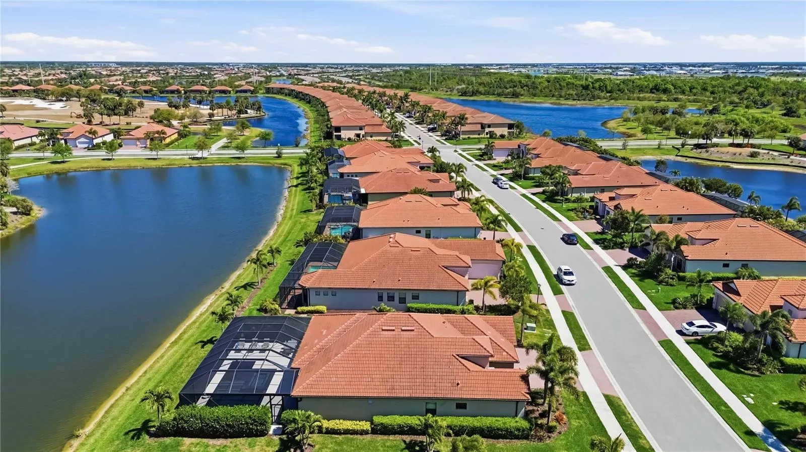 Aerial of 10744 Tarflower- water behind the home on the second hole