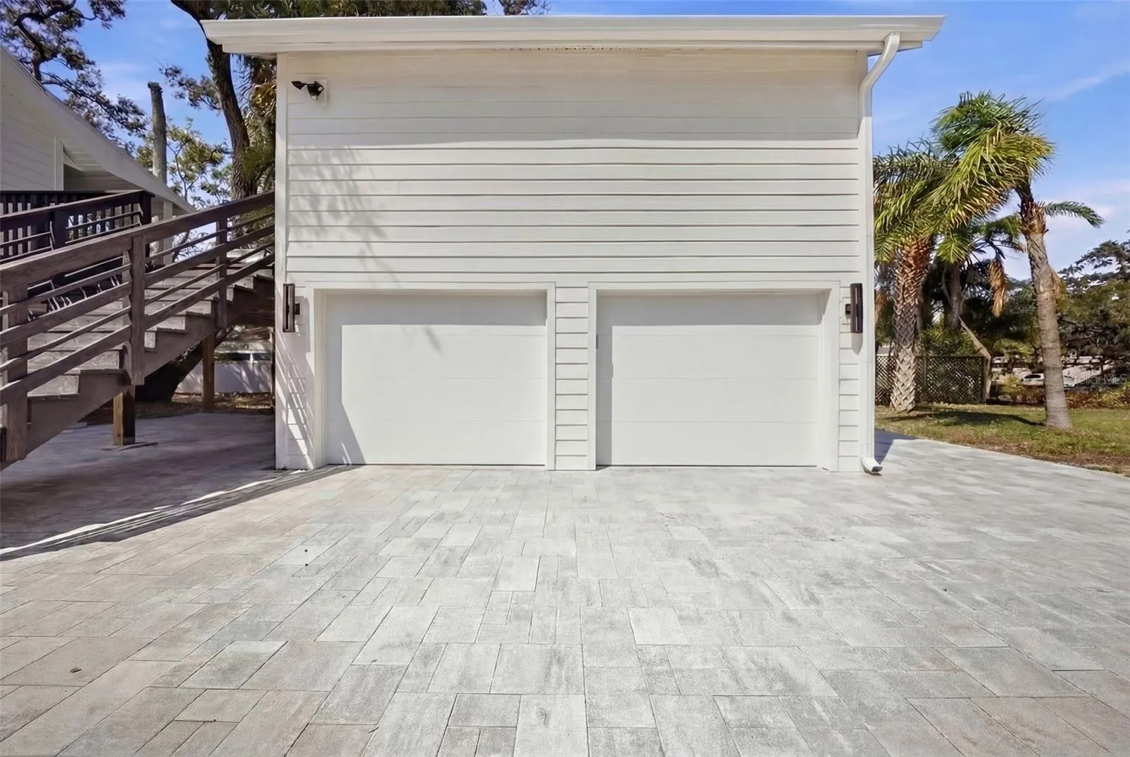 Staged. Impact rated garage doors will be installed before closing