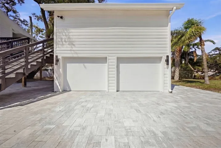 Staged. Impact rated garage doors will be installed before closing