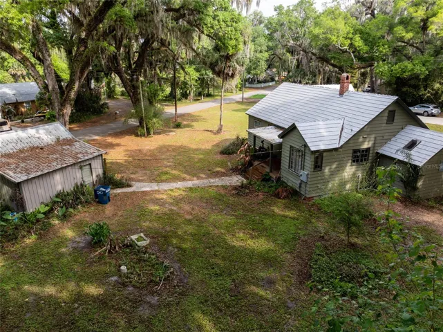 Home with walkway to detached garage
