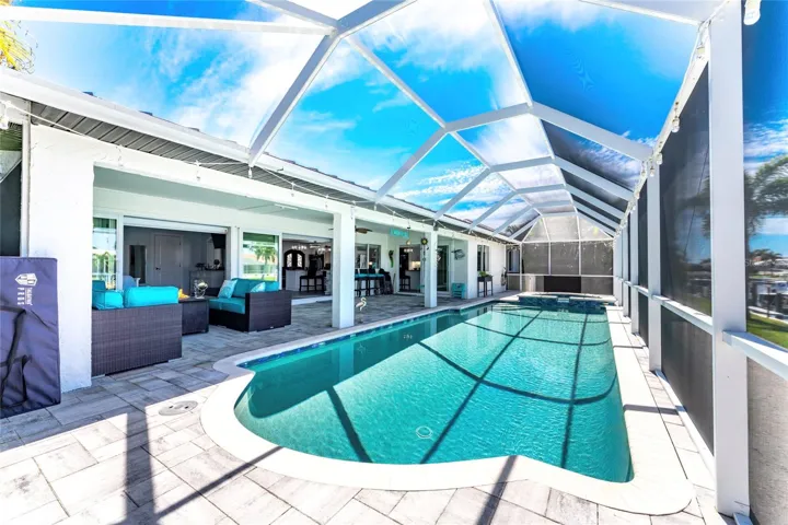 Pocket sliding glass door expand this living space poolside and beyond