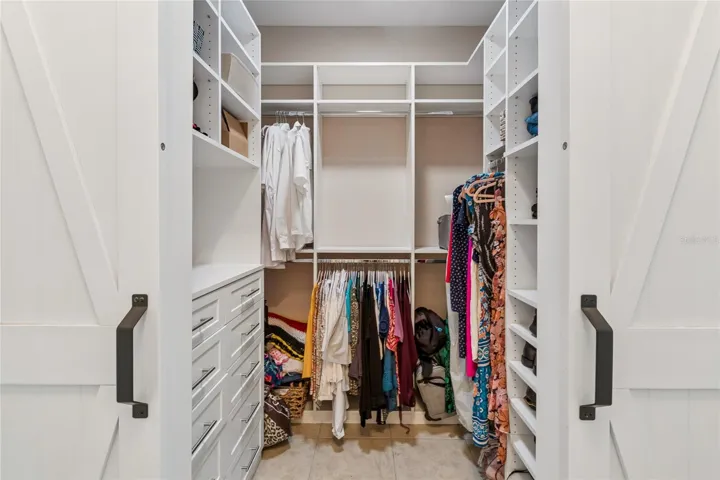 WALK-IN CLOSET W/CUSTOM BUILT INS