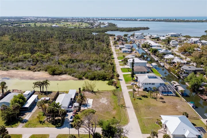 View from the east side, note the pone that this lot backs up to.   In the distance is the intercoastal and the Gulf of Mexiso.