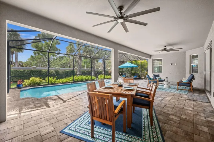 Covered lanai with dual fans perfect for entertaining