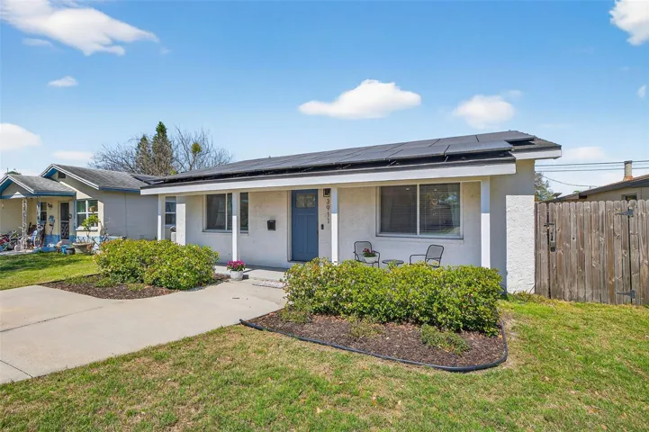 Welcoming front porch, and energy-efficient solar panels