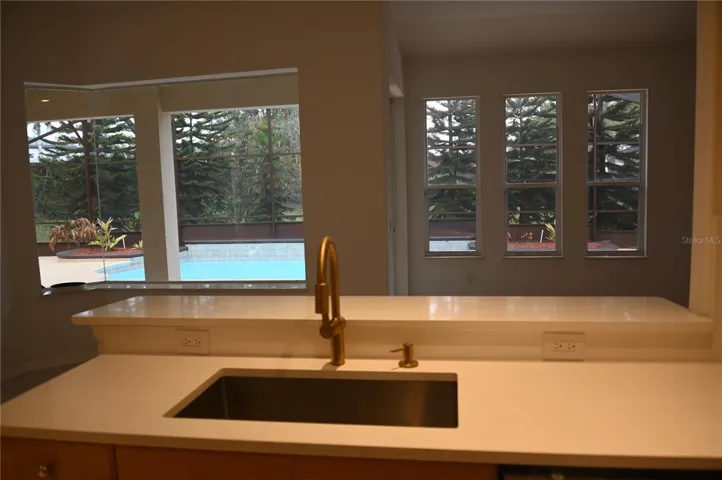 View of the pool area from the Kitchen