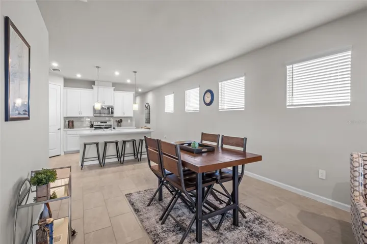 Bright and open kitchen that flows seamlessly into the dining and living areas.