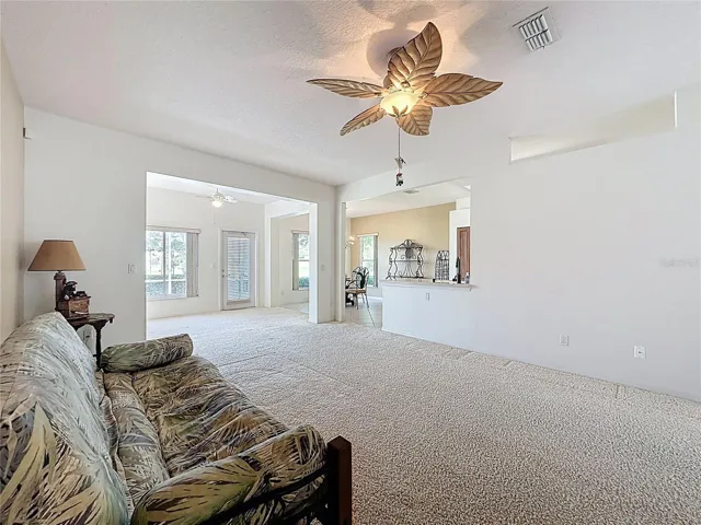 Family room with view into kitchen and Fl room