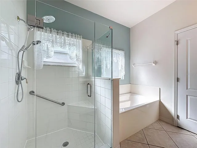 Walk in shower and a garden tub