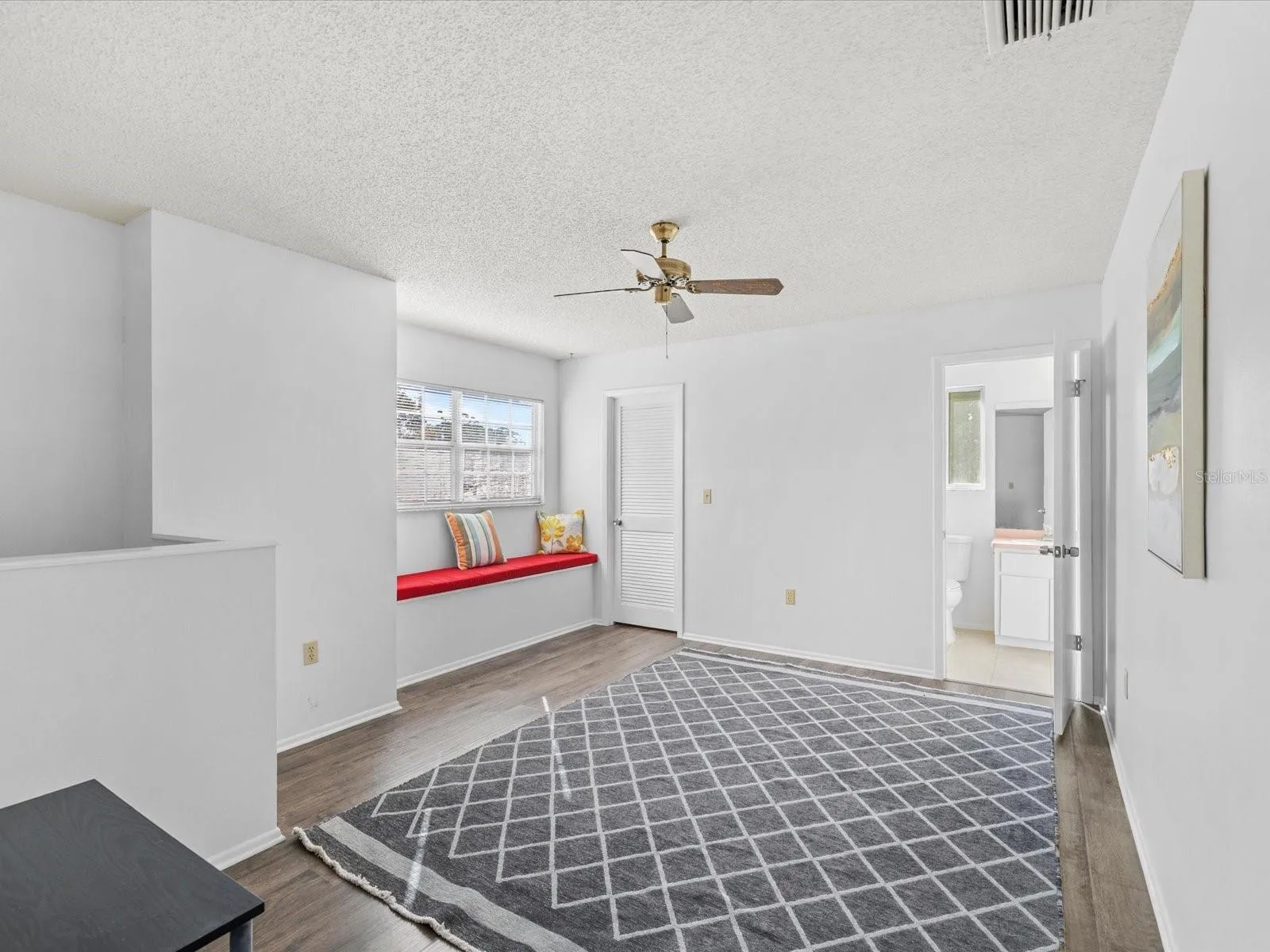 The Primary second bedroom is oversized and includes a sitting area, making it ideal for use as a second living room, home office, or hobby space
