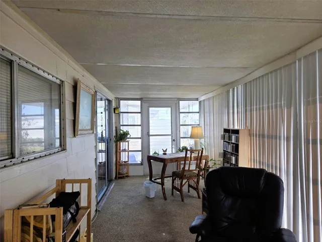Florida Room on side of home through he sliding glass doors