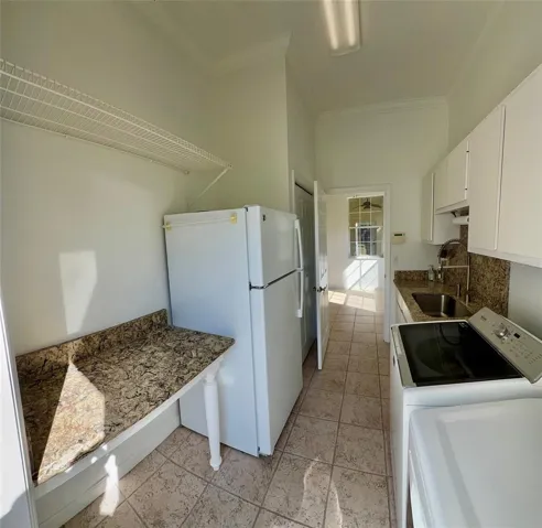 Inside Laundry with sink & folding station