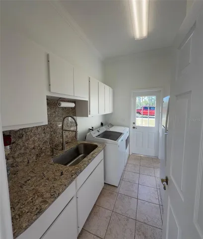 Inside Laundry with sink & folding station