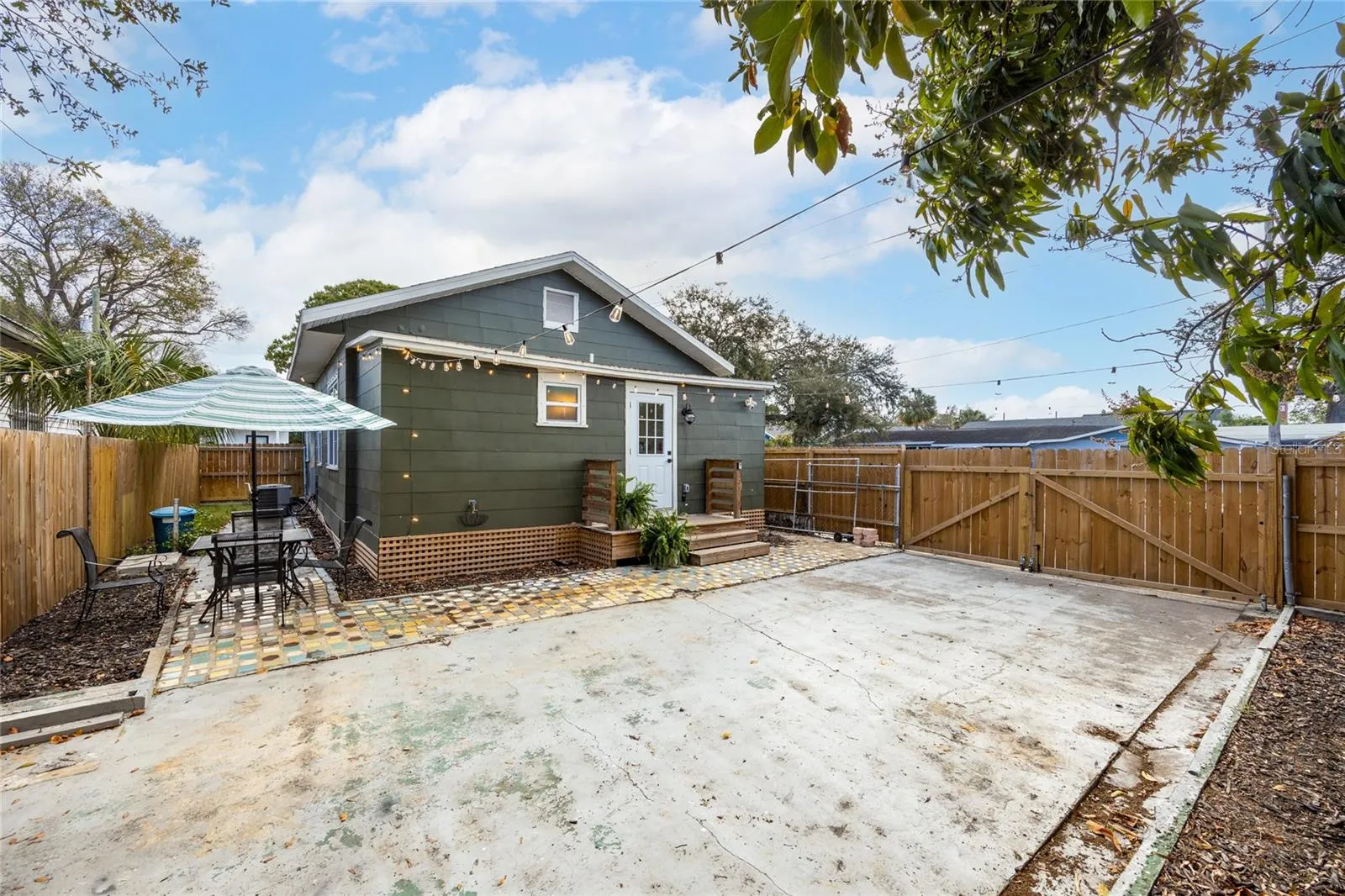 side yard perfect for entertaining or a furry friend