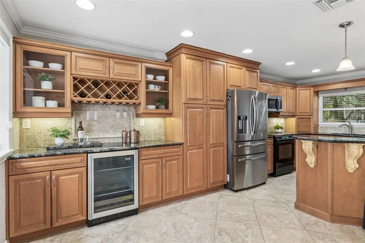 Well appointed kitchen is complete with a beverage bar.