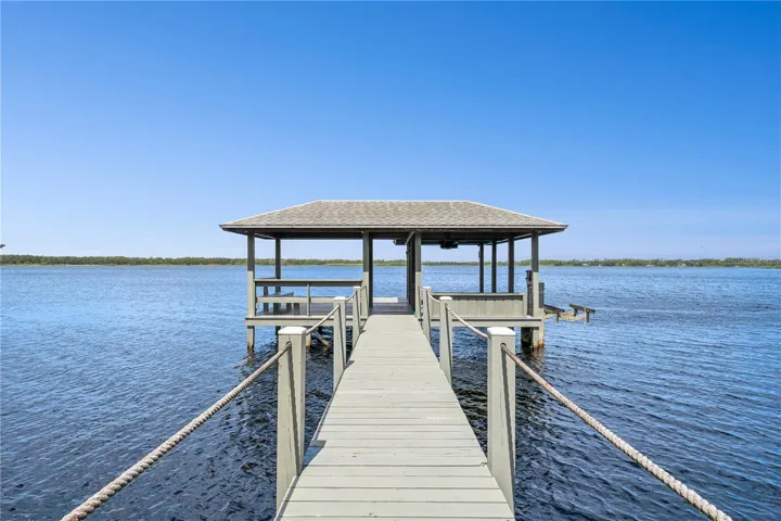 LAKEFRONT LIVING on pristine Lake Mary Jane.  Enjoy fishing, skiing and boating on this 1100 acre lake, or boat over to Lake Hart via canal through Moss Park! Views are of tree lined Moss Park!