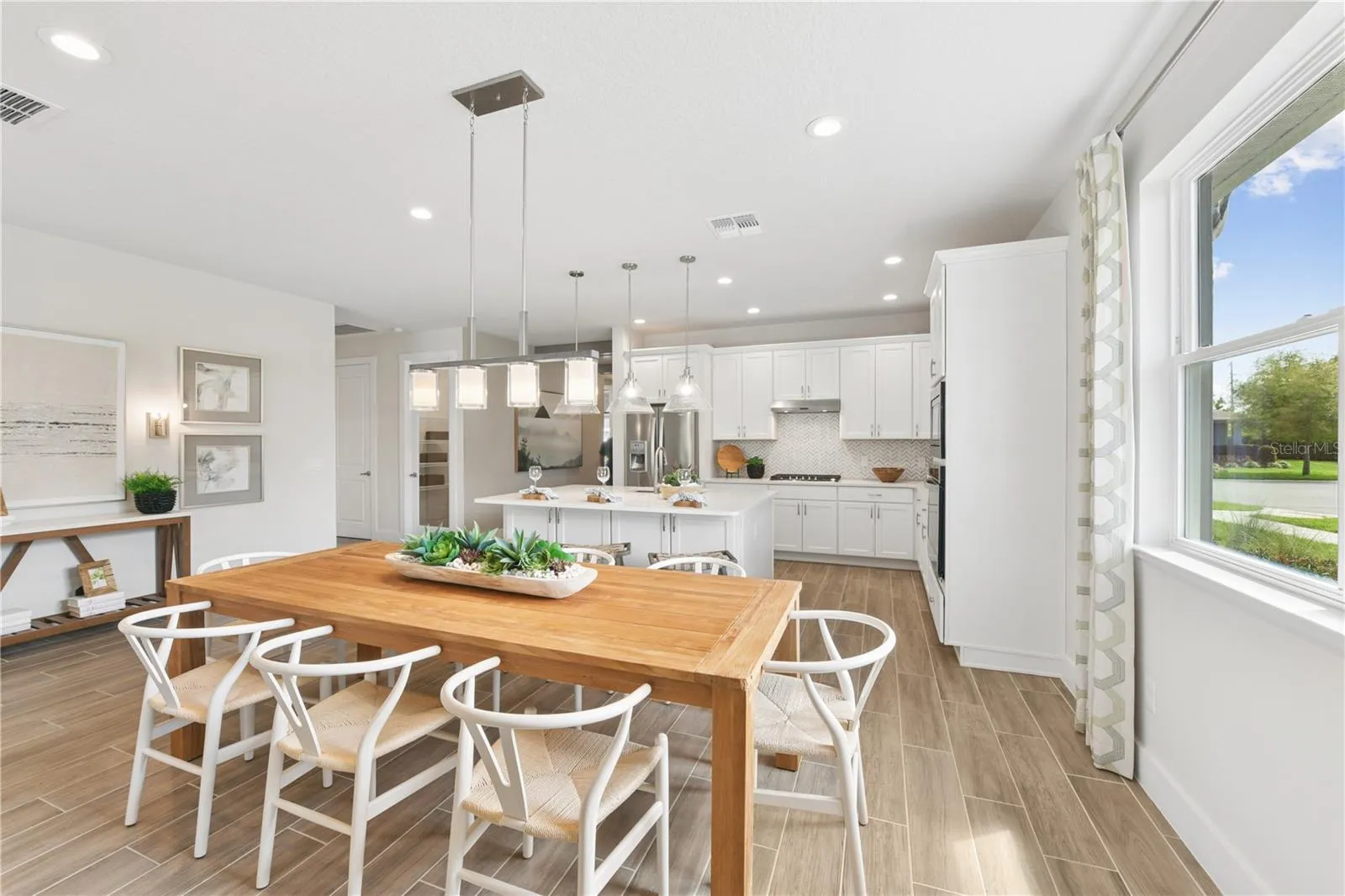 Casual dining space overlooks the kitchen making it the perfect space for entertaining