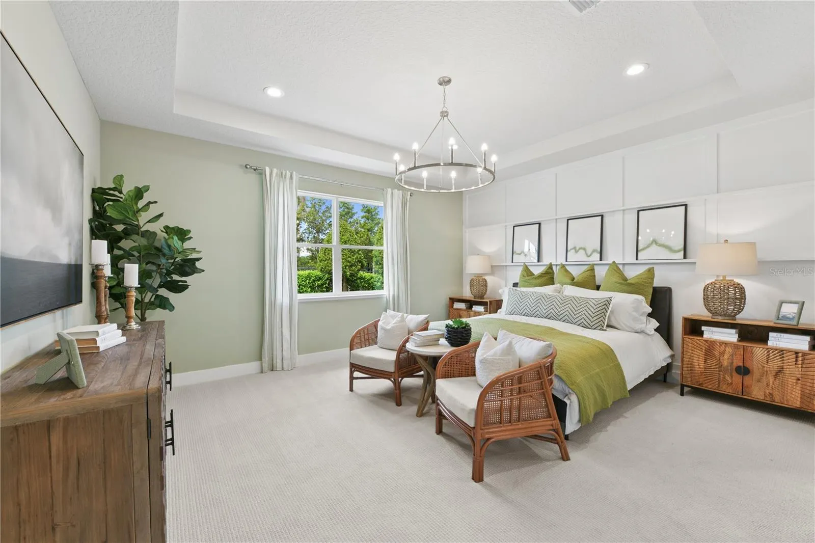 Spacious primary suite with soft, calming tones and a luxurious ensuite featuring a freestanding tub, walk-in shower, dual vanities, and walk-in closet.