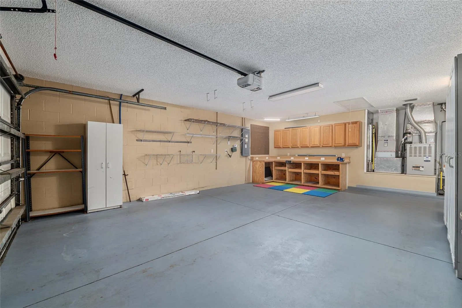 Garage (Alternate View): Large garage layout offers ample room for vehicles, storage, and flexible use.