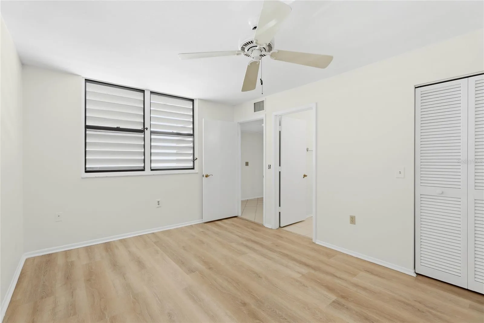 Second Bedroom Walk In Closet on right and entrance to bathroom