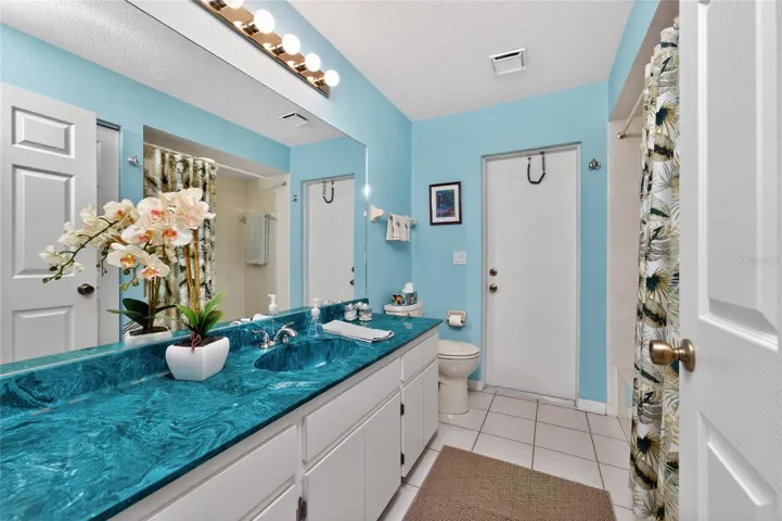 Guest Bath has a spacious vanity with a cultured marble top