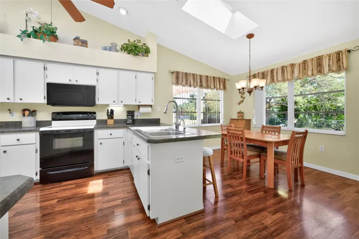 Plenty of cabinetry and countertop space, plus a breakfast bar!