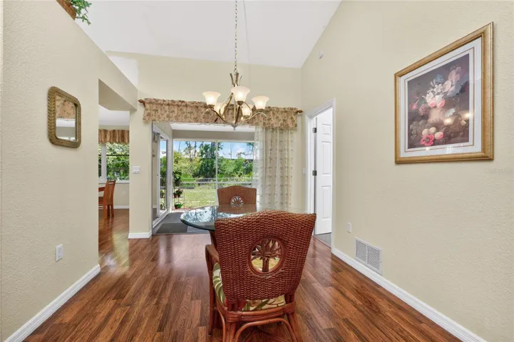 Formal dining area has sliding glass doors opening onto the lanai