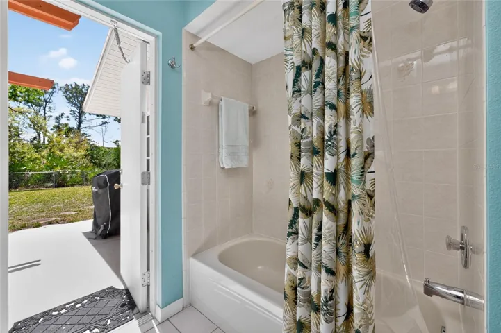 Guest bath opens onto the rear patio - perfect if you ever added a pool!