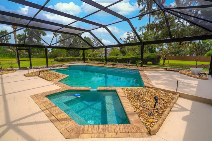Screen Enclosed Sparkling Pool and Spa