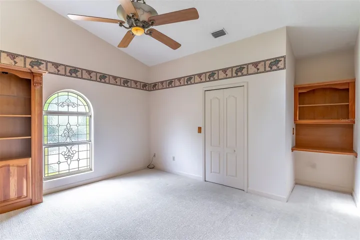 Bedroom 3 with Built-In Desk and Wooden Bookcases