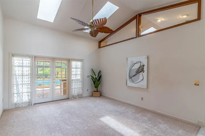 Living Room with Access to Paver Patio & Pool
