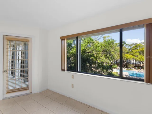 Primary bedroom with gorgeous pool views!