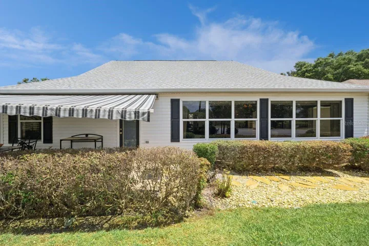 Rear view of home with Awning extended.
