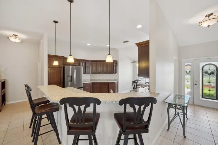 Kitchen Island sporting Chairs.