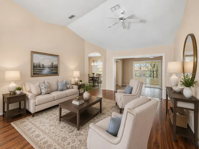Virtually Staged-Interior entry greets you with high ceilings, engineered wood flooring overlooking the dining and living rooms