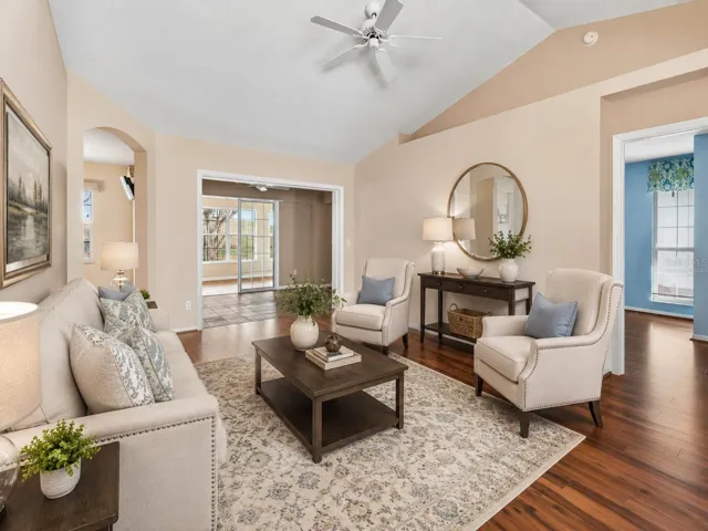 Virtually Staged-Interior entry greets you with high ceilings, engineered wood flooring overlooking the dining and living rooms