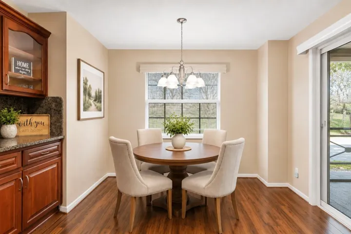 Virtually Staged-Kitchen Nook/Dinette overlooks kitchen and Family Room