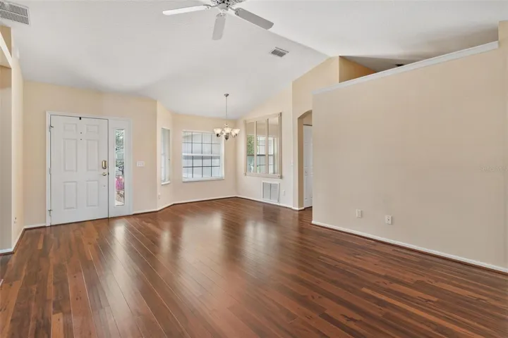 Interior entry greets you with high ceilings, engineered wood flooring overlooking the dining and Living Rooms