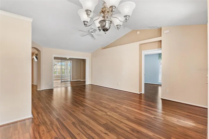 Interior entry greets you with high ceilings, engineered wood flooring overlooking the dining andliving rooms