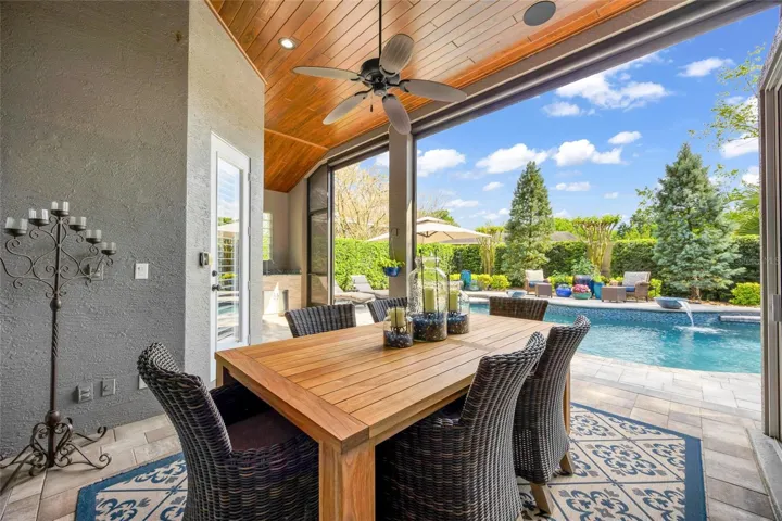 sophisticated lanai features retractable screens via remote