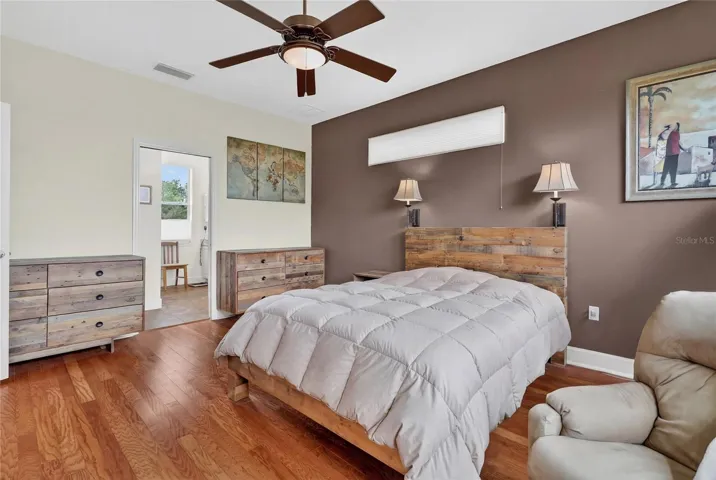 Primary bedroom with ceiling fan