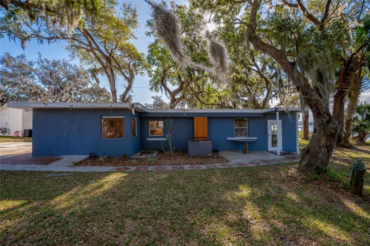 Detached in-law suite set beneath mature oak trees with beautiful water views.