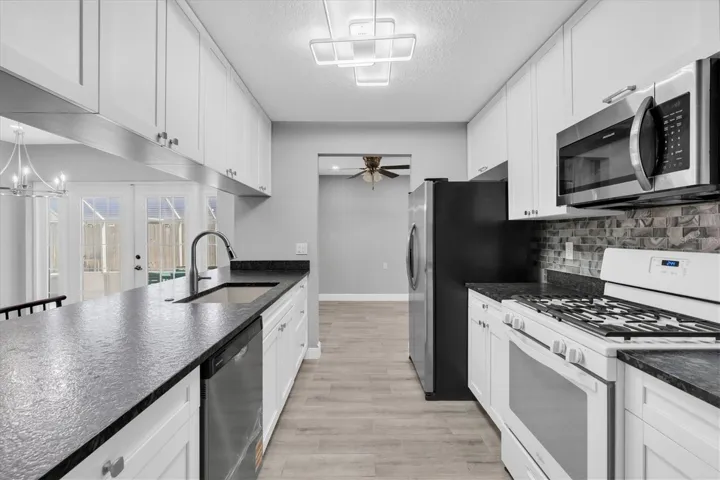 Nice and bright. Lots of counter and cabinet space