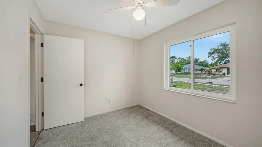 Bedroom 3 looks out to the front yard