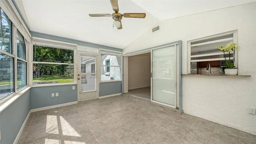 Family room has pocket sliders and exits to brick paver patio