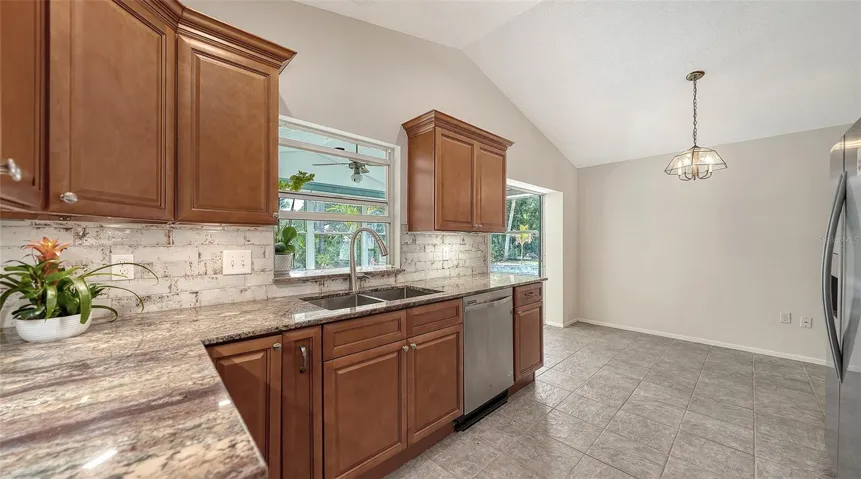 Kitchen opens to the family room & has views of the rear yard
