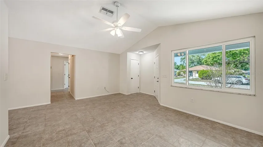 Spacious living room with cathedral ceiling